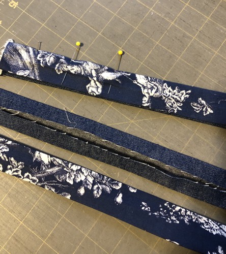 Position and pin the denim and lining strips wrong sides together.